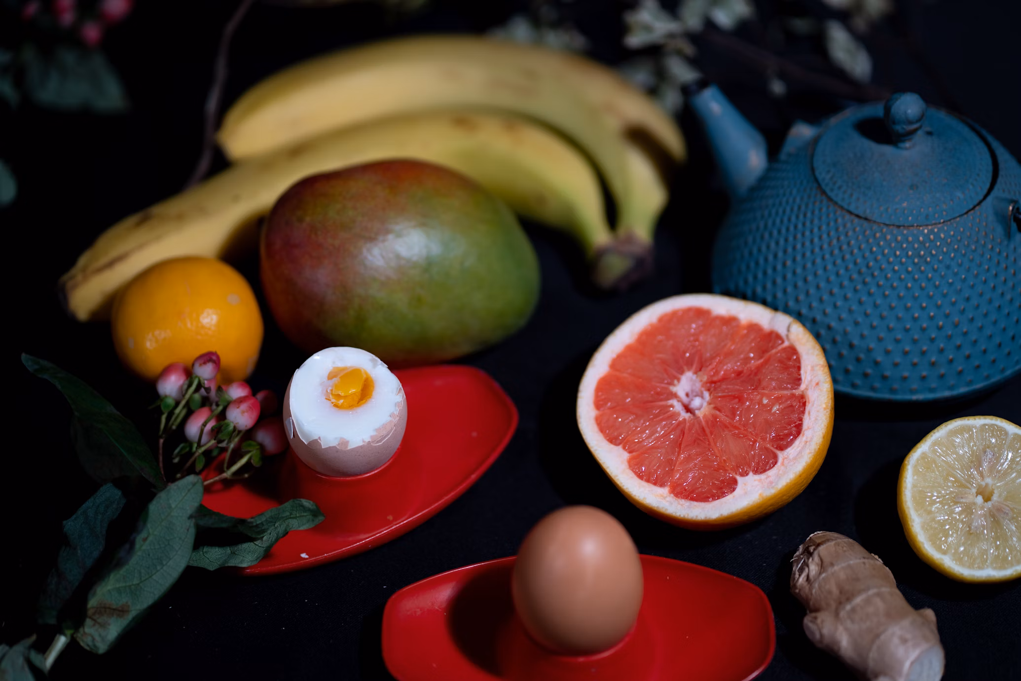 Selection of nutritious foods including salmon, leafy vegetables, berries, and whole grains